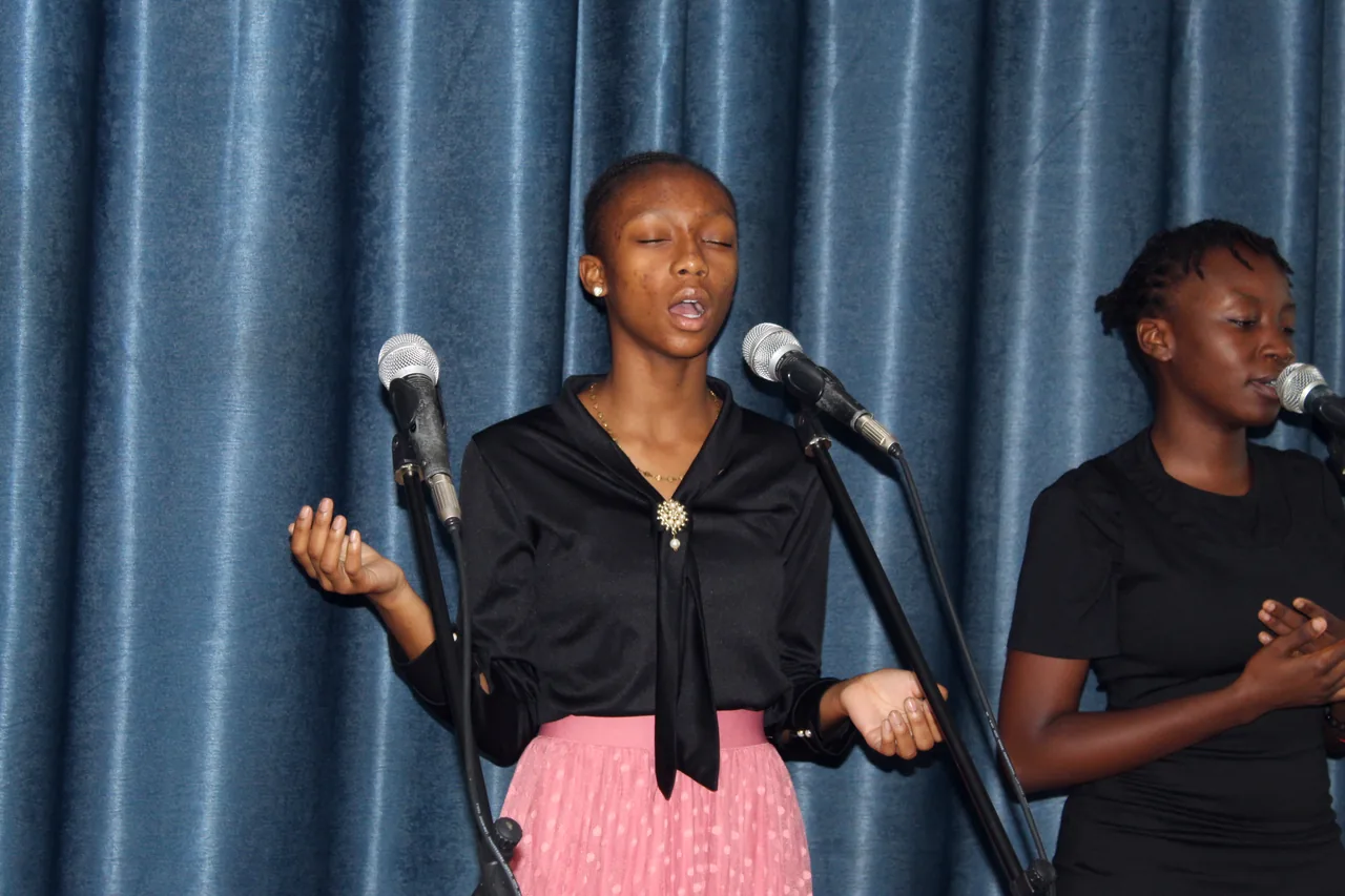 Vocalists worshipping at the mics